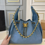 Chanel denim bag in light blue with a gold chain